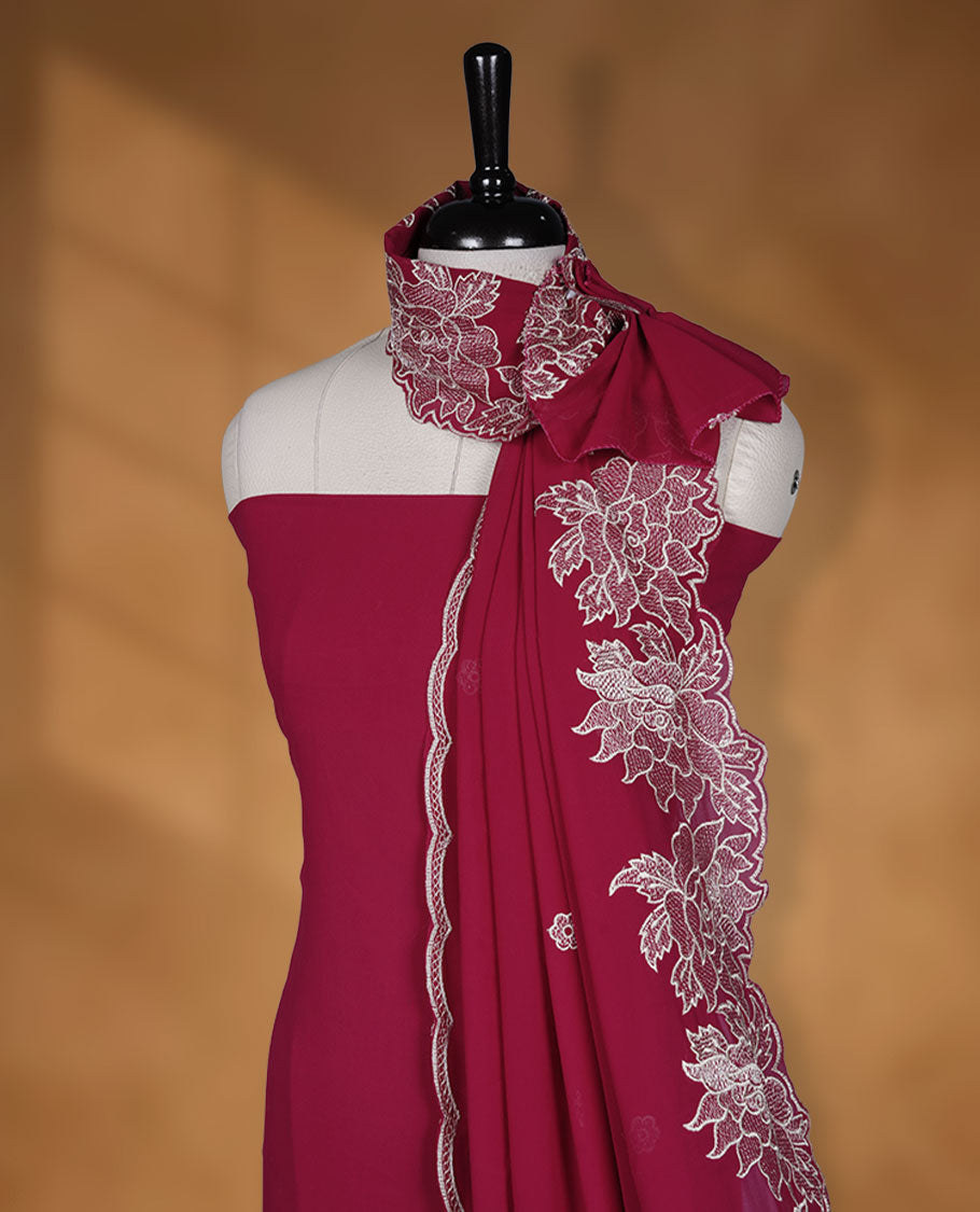 Reddish Maroon colour georgette salwar material with elegant thread work on the body, paired with a flowy dupatta featuring delicate detailing, and complemented by a plain bottom for a graceful finish.