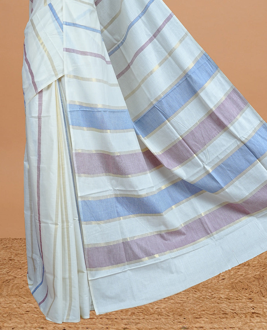 Cream Colour Cotton Kerala Saree Featuring Periwinkle  Blue & Light  Purple Strips On The Body & Pallu, Paired With A Matching Blouse Piece.