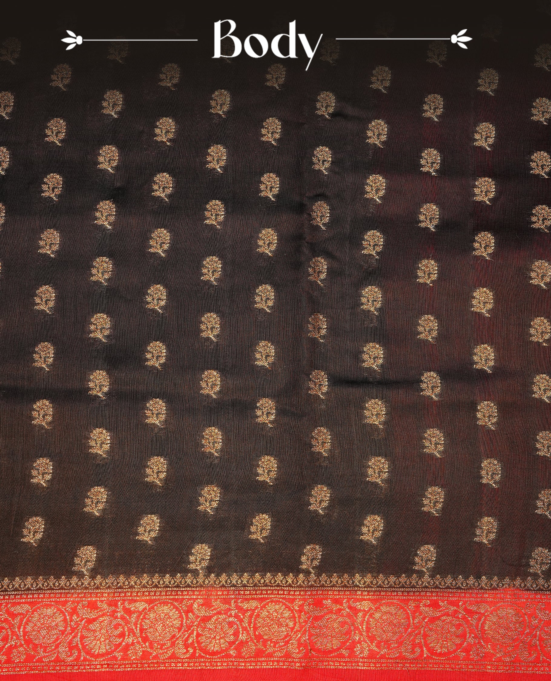 Chocolate colour Banaras tussar silk saree featuring elegant gold zari buttas across the body, complemented by a contrast Red border with rich zari detailing. Comes paired with a matching blouse piece.