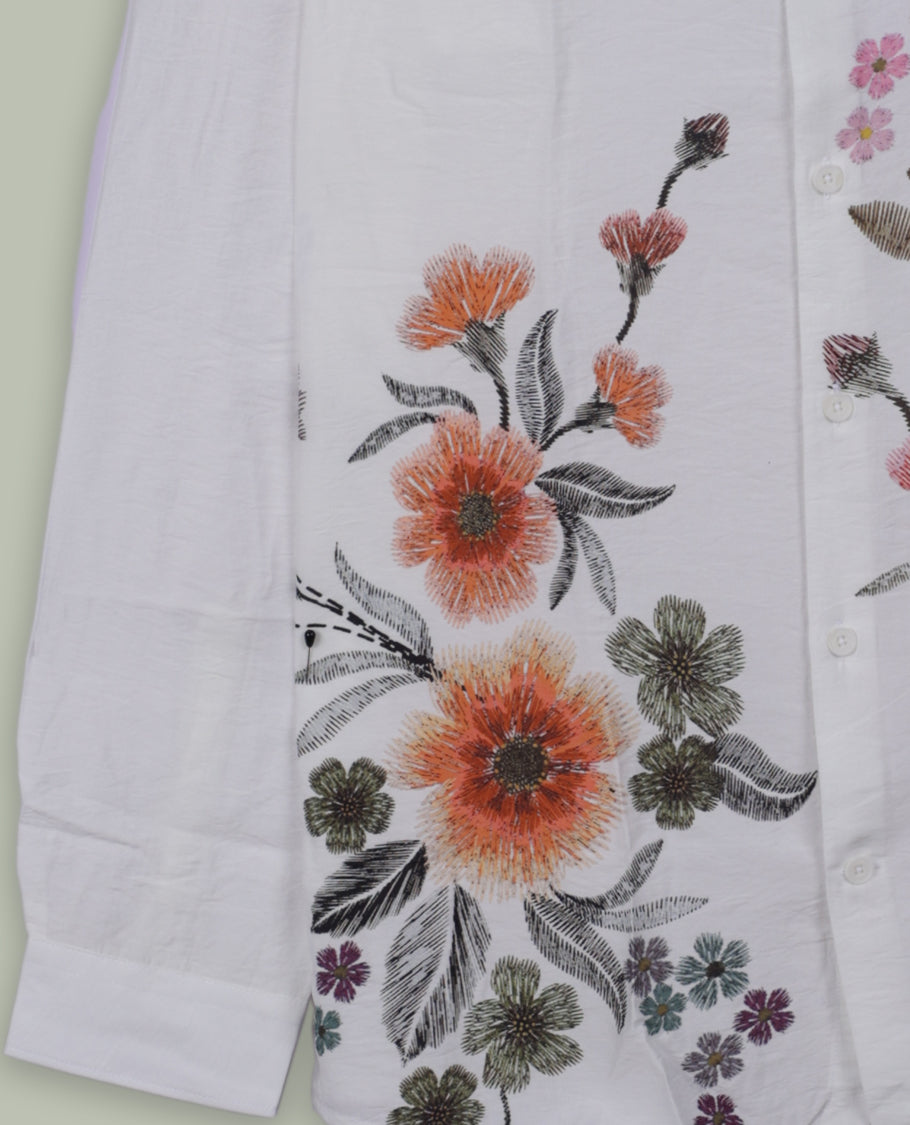 Off white colour full sleeve shirt features a rounded spread collar and a watercolor style floral print in orange, majenta, and green & its ideal for both casual days and laid back evenings.