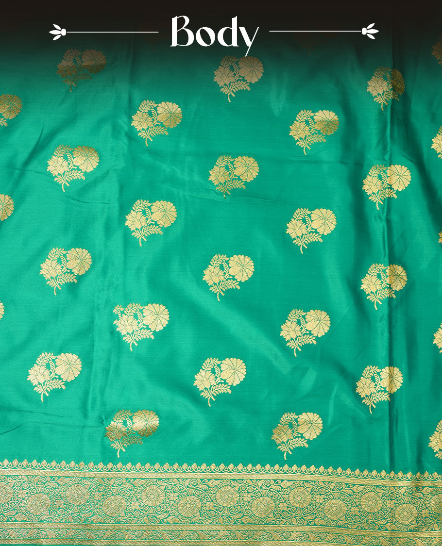 Green colour Banaras Satin Crepe saree featuring gold zari floral motifs on the body, a richly woven traditional border with intricate gold zari detailing, and paired with a matching blouse.