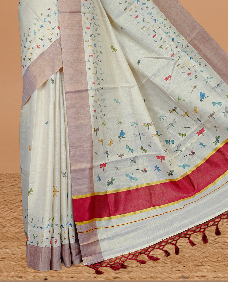 Cream Colour Tissue Kerala Saree Featuring  Plain Body ,Complemented By Red  Zari With Dragonfly Printed   Border ,Enhance By A  Red With Gold Zari  Pallu ,Paired With A Matching Blouse Piece.