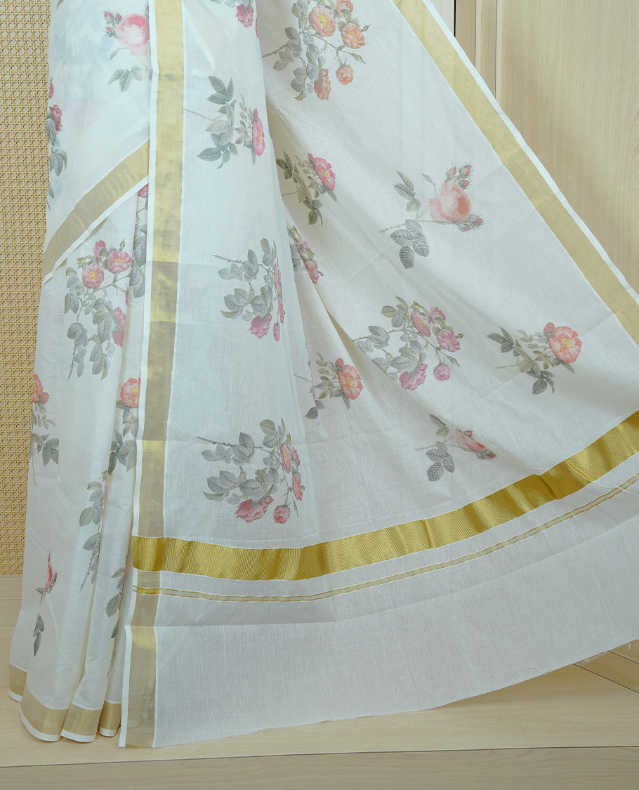 Cream colour Cotton kerala Saree featuring Flower Print on body, Enhancing Gold zari kasavu border, comes with matching blouse piece.
