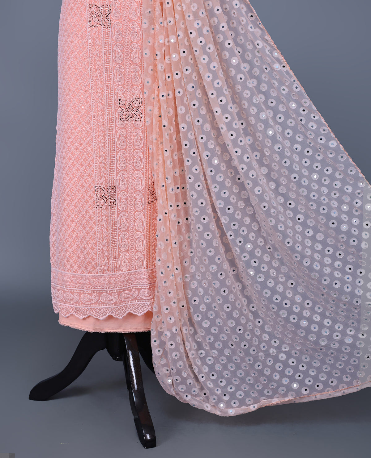 Peach  Colour Georgette Salwar Material featuring elegant Chikankari work on the kurta, paired with a matching bottom and a sequins-embellished dupatta.