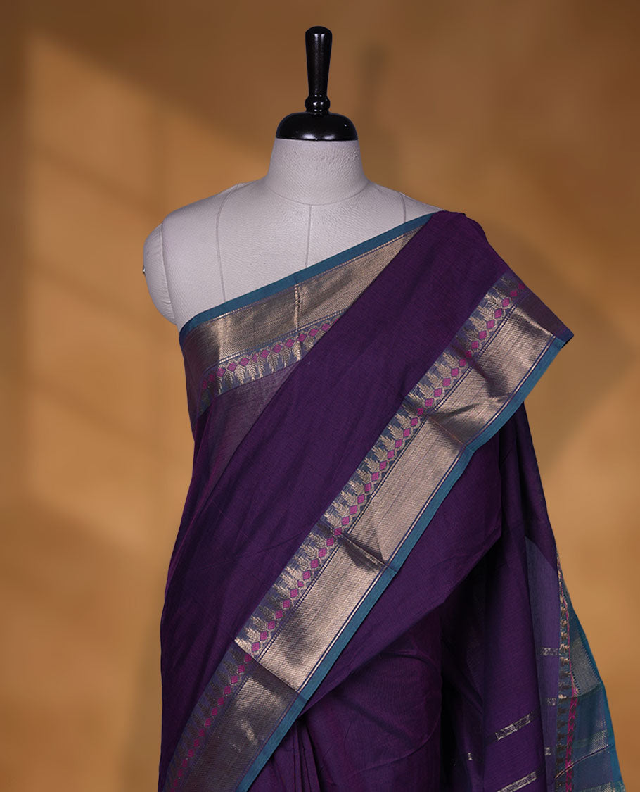 Purple colour chettinad cotton saree featuring Elegant plain body, contrast green colour border with gold zari border, pallu and paired with matching blouse.