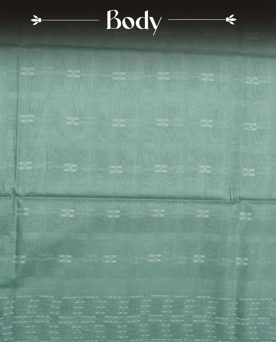Mint colour semi jute saree highlighting white thread motifs on body, without border and paired with matching blouse.