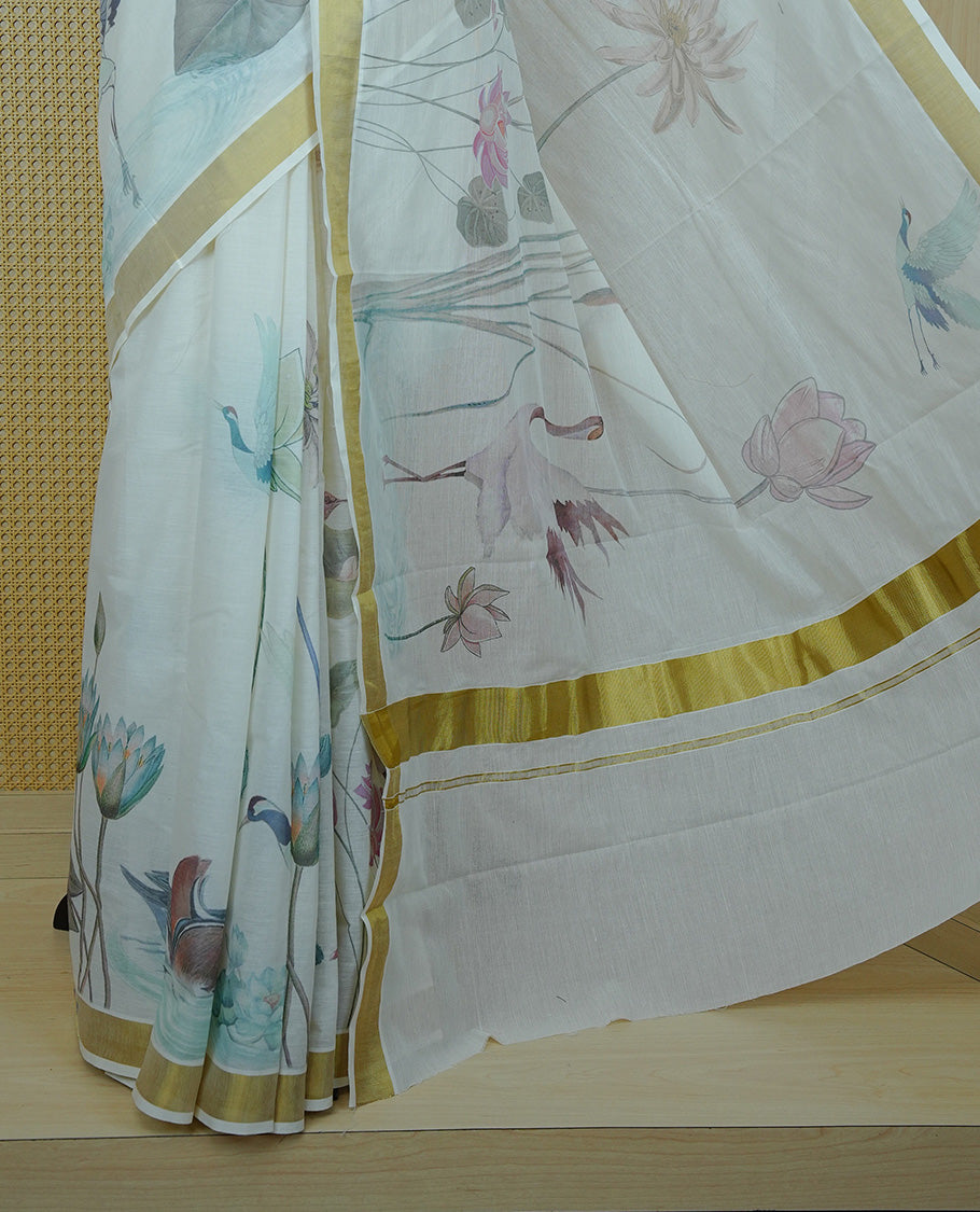 Cream colour Cotton kerala Saree featuring Flower & Bird Print on body, Enhancing Gold zari kasavu border, comes with matching blouse piece.