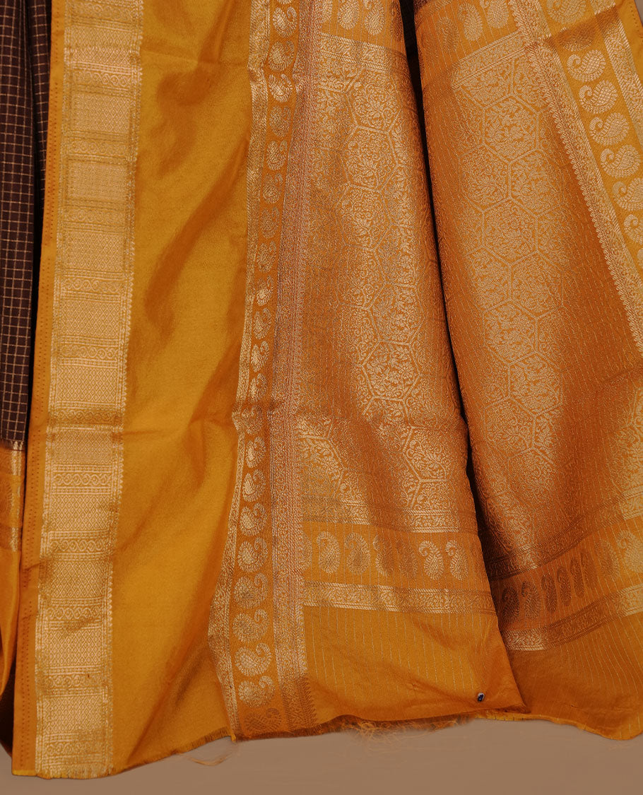 Chocolate colour semi georgette saree featuring gold zari check pattern on body, complemented by contrast Mustard colour with zari border, paired with matching blouse piece.