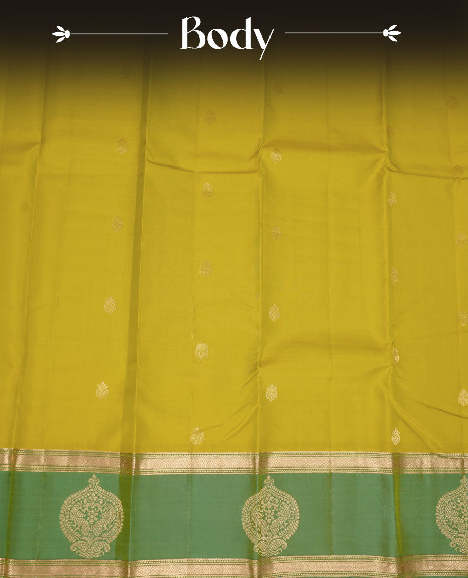 Fluorescent green colour Vasundhara silk saree featuring elegant gold zari buttas across the body, complemented by a contrast leaf green zari border, and paired with a matching blouse piece.