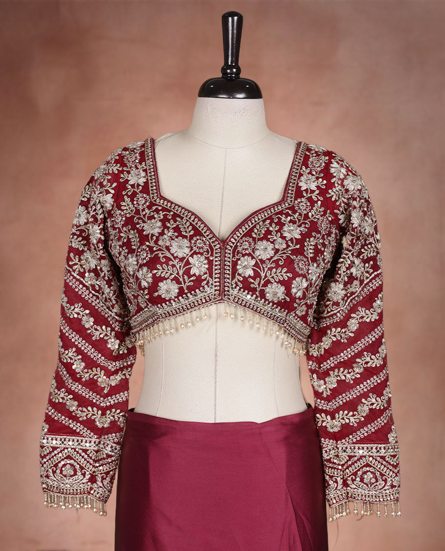 Maroon Colour net designer Wedding saree featuring all over floral embroidery with sequin detailing and an ornate scalloped border, finished with a matching embellished blouse.