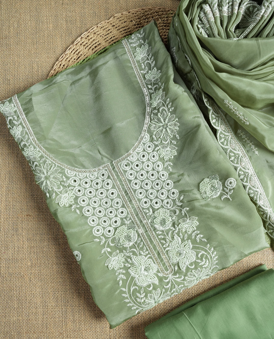 Pastel green colour suit material adorned with elegant white thread , cut beads & sequin embroidery, highlighted by a delicate lace border & Paired with a matching embroidered dupatta and plain bottom.