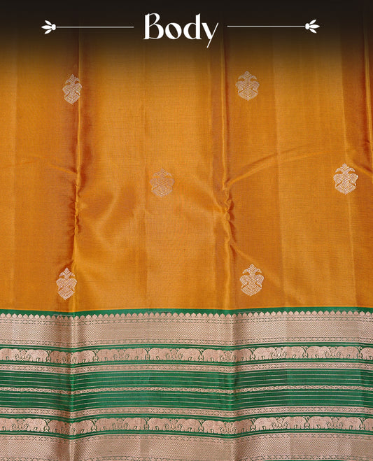 Mustard Colour Kancheepuram silk saree featuring gold zari motifs on body, highlighting Gold zari Elephant Traditional On contrast Green border, paired with Matching blouse piece.