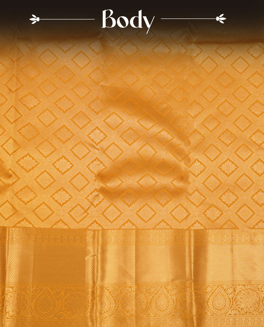 Golden mustard colour kancheepuram silk saree featuring Floral and diamond zari jacquard on body with traditional zari border, paired with matching blouse piece.