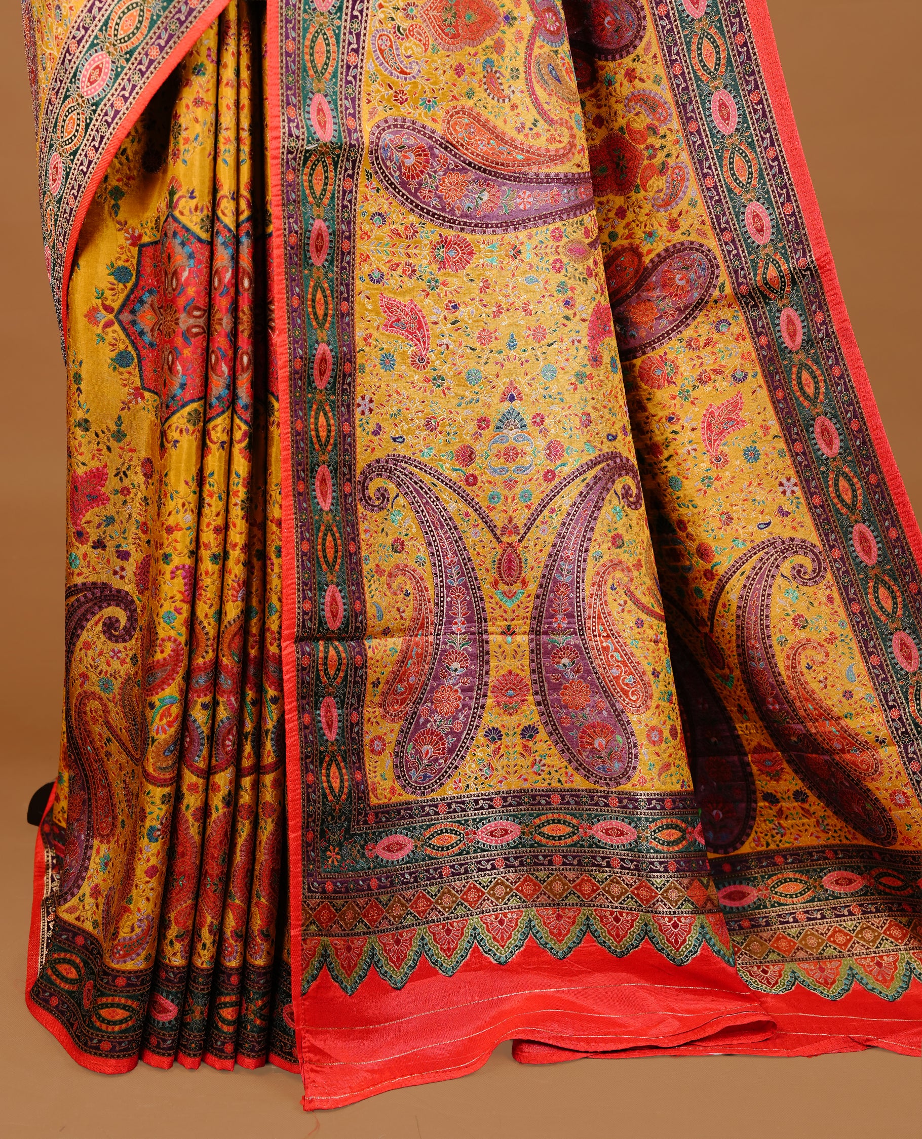 Mustard yellow colour Pashmina Saree featuring multicolour floral and paisley woven body, a contrast multicolour geometric border with red edging, an ornate paisley woven pallu, paired with a matching blouse.