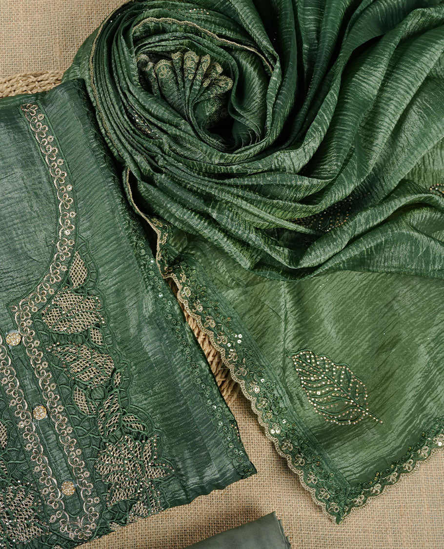 Deep green churidar suit material with delicate lace and sequin embroidery, paired with a textured matching dupatta and a plain coordinating bottom.