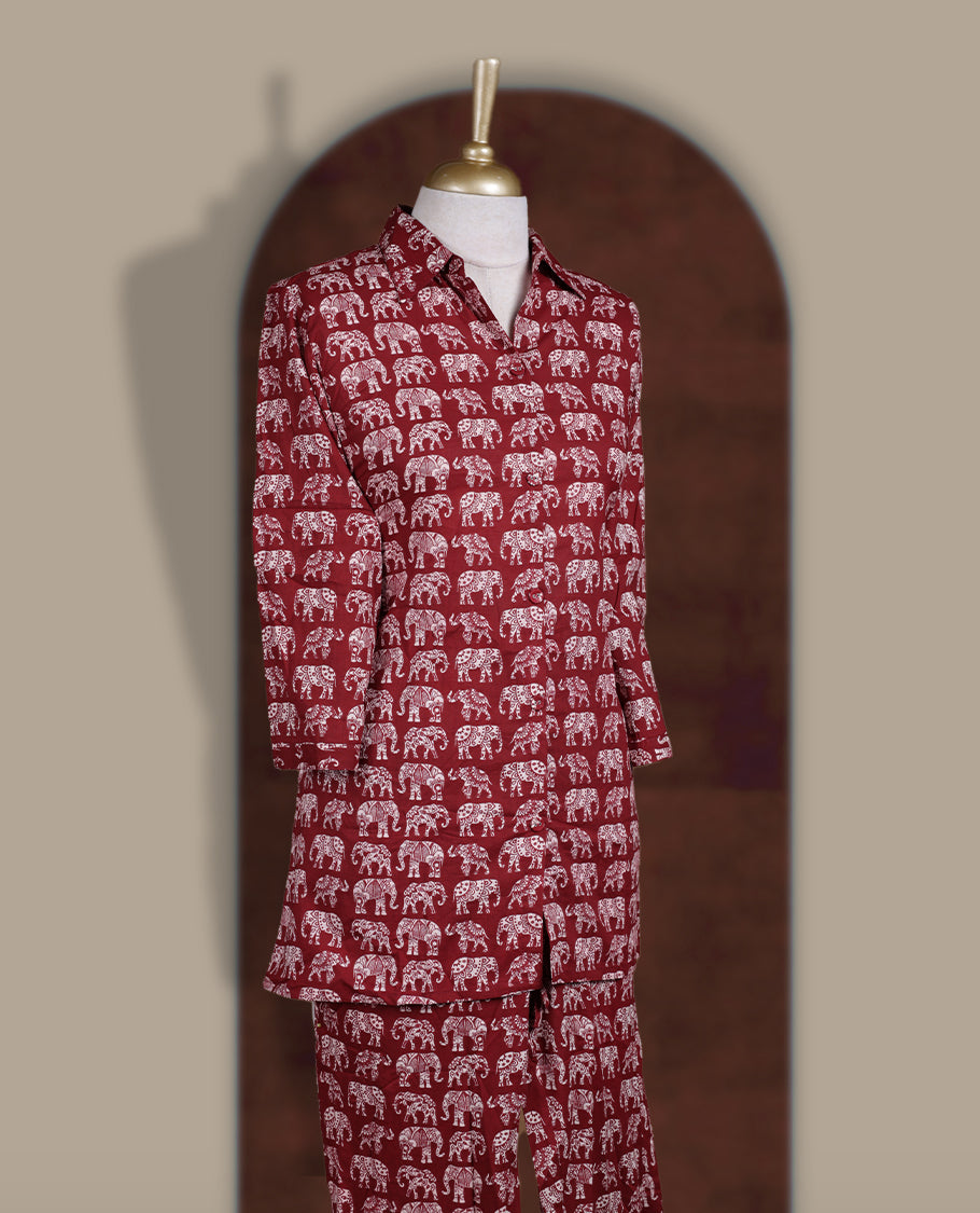 Maroon colour cotton coord set featuring charming elephant prints all over, Designed with a classic shirt collar and 3/4 sleeves, paired with matching straight pants for a trendy, relaxed, and comfy everyday look.
