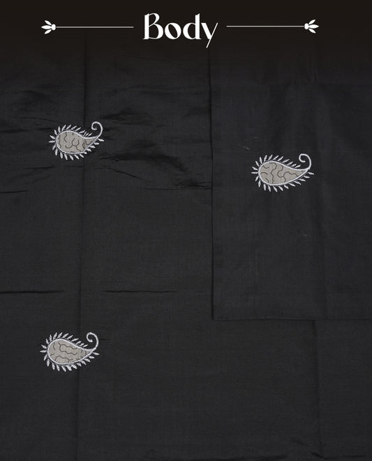 Black colour Polycotton Saree adorned with beige colour paisley ajrakh design on the body and pallu, complemented by a contrast printed blouse piece.