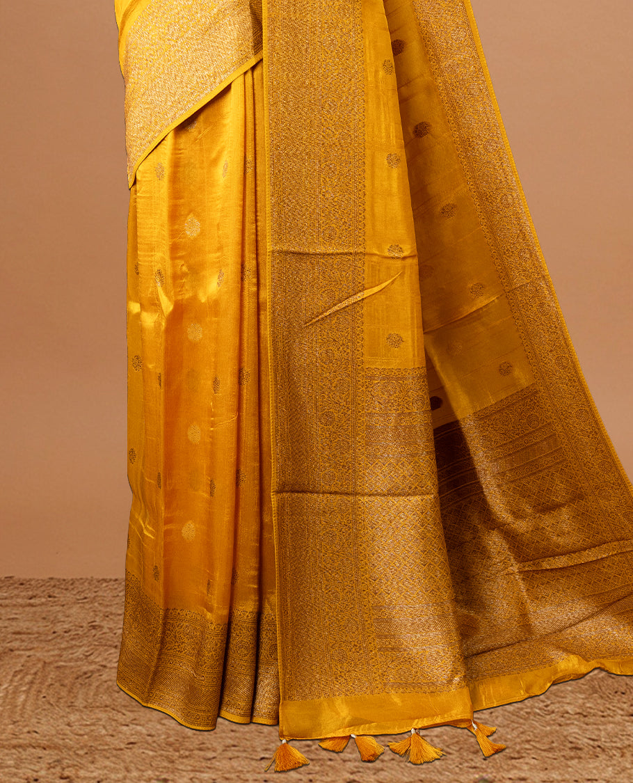 Yellow colour Semi banaras tussar georgette Saree featuring Antique zari motifs on body, enhanced with antique zari border, paired with a matching blouse piece.