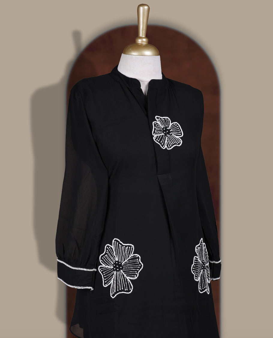 Black colour coord set featuring elegant pearls and cut beads floral embroidery work, mandarin collar, and sheer 3/4 sleeves, Paired with matching pants, it offers a sleek, modern look perfect for refined casual wear.