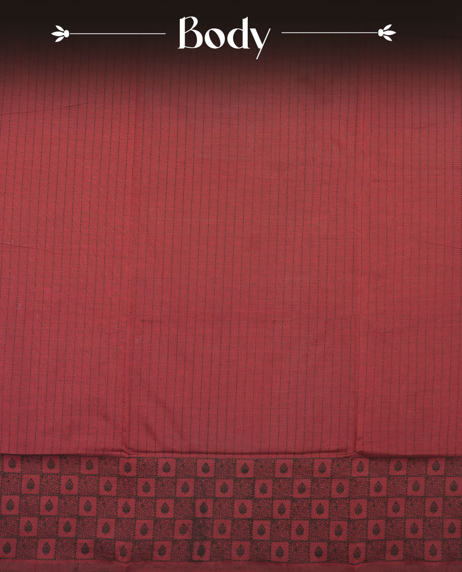 Dark Red colour poly cotton saree with black vertical dotted line pattern on the body, paired with a matching pallu featuring black zigzag geometric border, and a coordinated all‑over black stylised fleur‑de‑lis printed blouse piece.