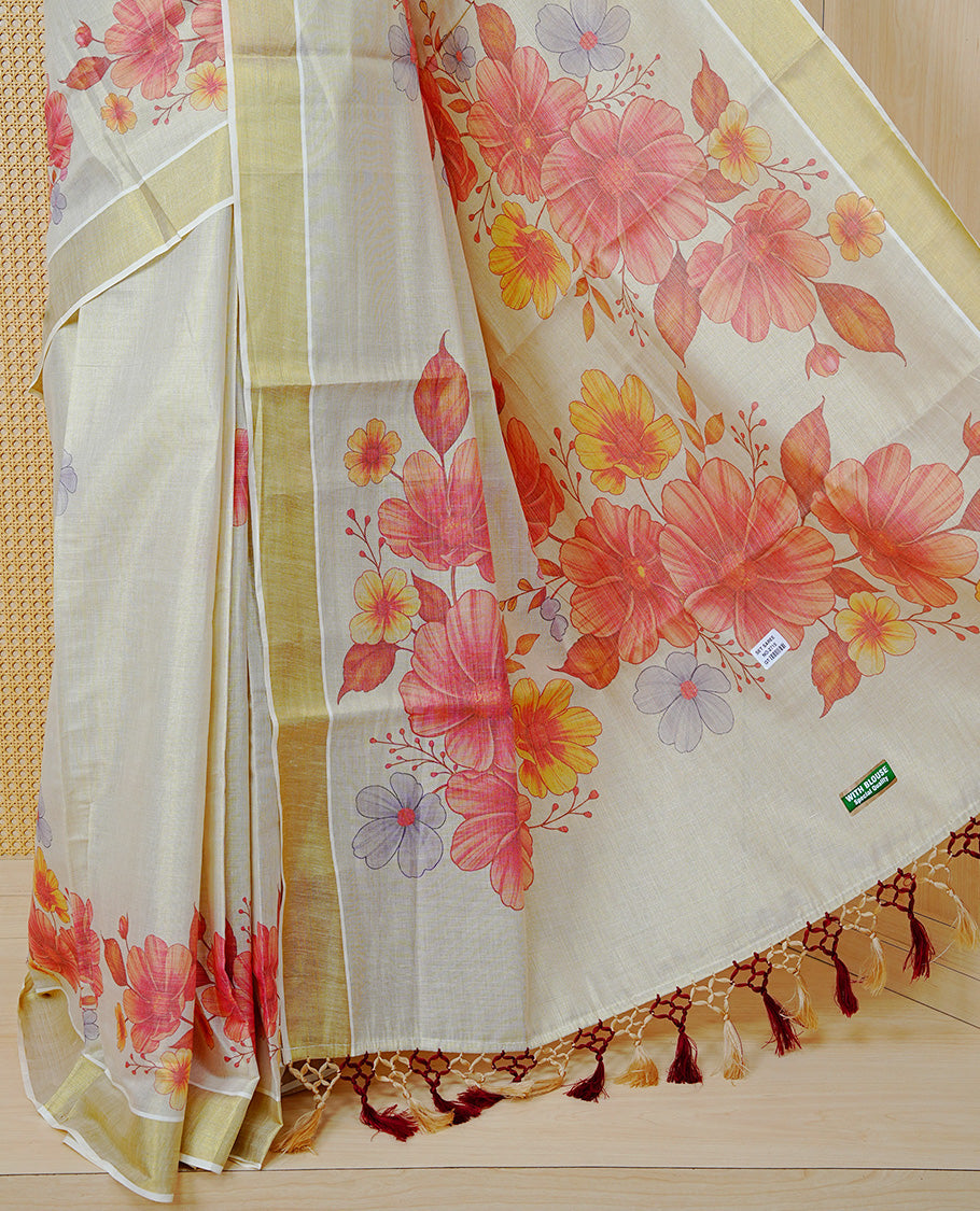 Cream Colour Tissue Kerala  Saree Featuring A Digital Floral Printed Body &  Pallu, , Beautifully Enhanced With A Classic Gold Zari Border And Cream & Brown  Tassels ,Paired With A Matching Blouse Piece.