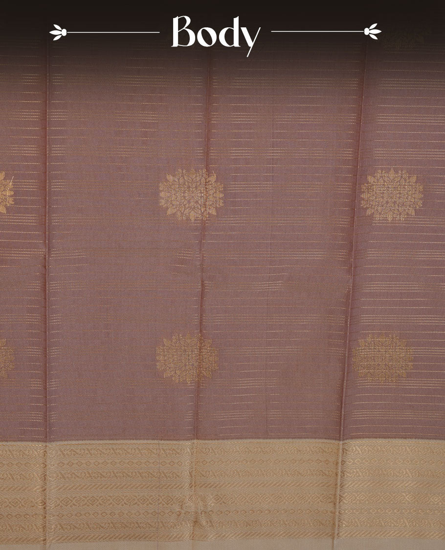 Nude brown colour semi silk saree highlighting gold zari strip pattern  and motifs across body, featuring contrast cream colour border with gold zari pattern, comes with matching blouse .