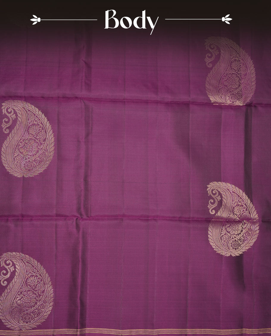 Purple colour soft silk saree featuring gold zari motifs on body, complemented by self colour with traditional  border with tassel at pallu, paired with matching blouse piece.