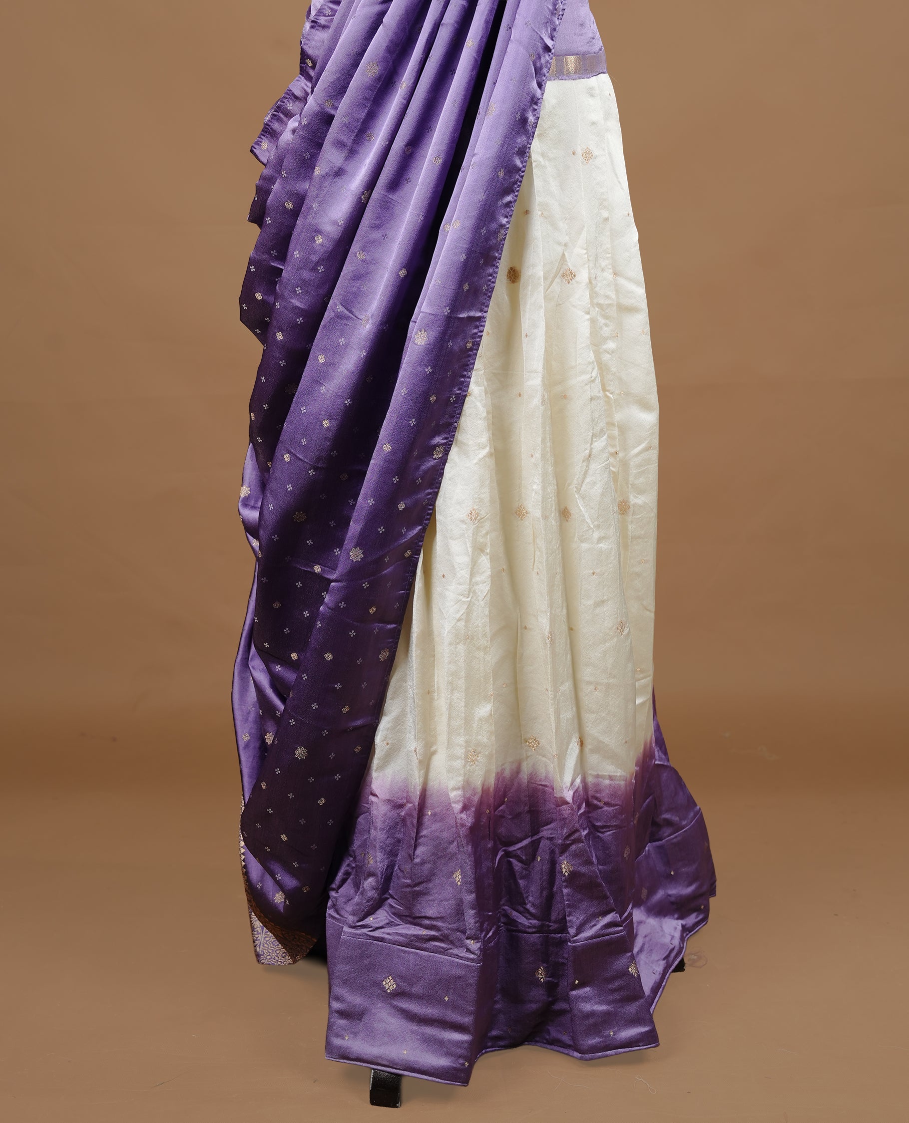 Off White colour half saree material featuring delicate zari buttas on the blouse and skirt, paired with a contrast Lavender zari border and matching small zari motifs dupatta