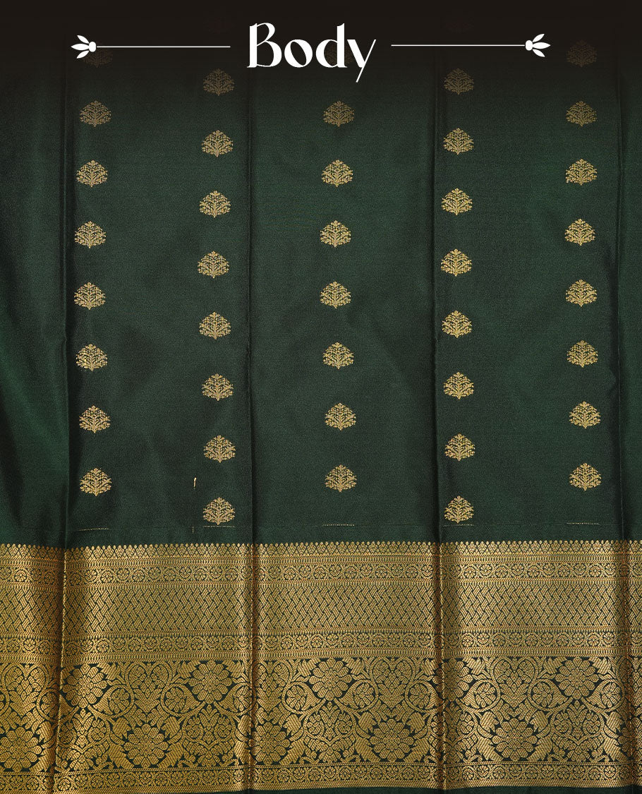 Dark green colour soft silk saree featuring gold zari motifs on body, complemented by self colour with traditional border, paired with matching blouse piece.