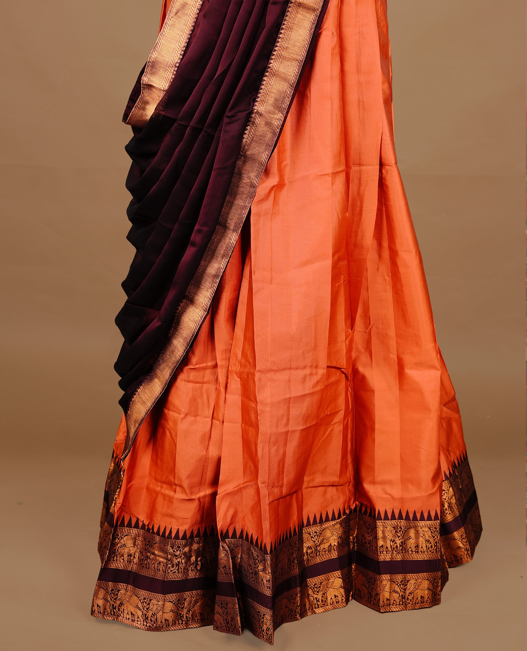 Rust orange colour semi stitched Half saree featuring contrast Maroon colour with gold zari traditional border skirt, paired with matching zari border dupatta, unstitched blouse piece