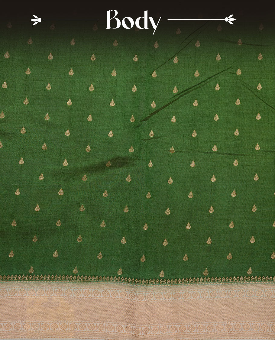 Green colour semi tussar saree featuring gold zari buttas across body, contrast cream colour gold zari border and comes with matching blouse piece.