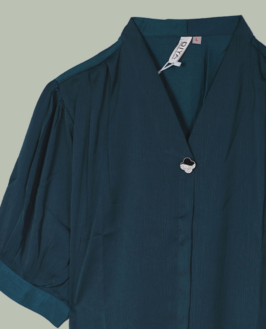 Teal blue V-neck shirt top with single decorative front button, elbow-length cuffed sleeves, and soft gathers at the shoulders.