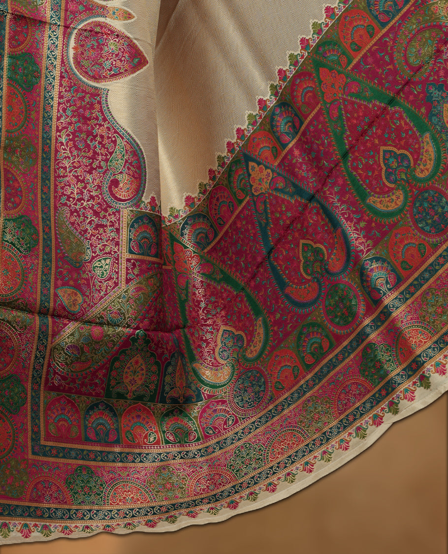 Ivory colour Pashmina silk saree featuring a sleek plain body, accentuated with an opulent multicolour paisley and floral panelled border and grand pallu, paired with a contrasting magenta woven jaal blouse piece.