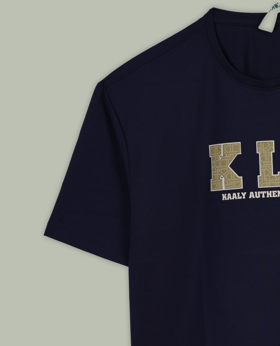 Navy blue colour T shirt featuring a bold  KLY Kaaly Authentic Wear  graphic on the chest, designed with a round neck and short sleeves, crafted from soft breathable fabric for a stylish and comfortable fit.