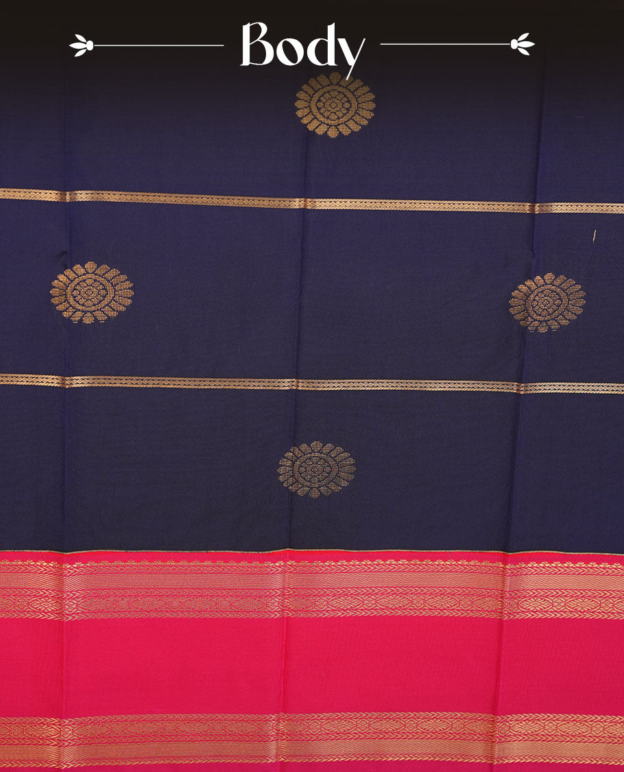 Navy blue colour semi silk saree highlighting gold zari strip pattern with motifs across body, featuring contrast rani pink colour border with gold zari pattern, comes with matching blouse .