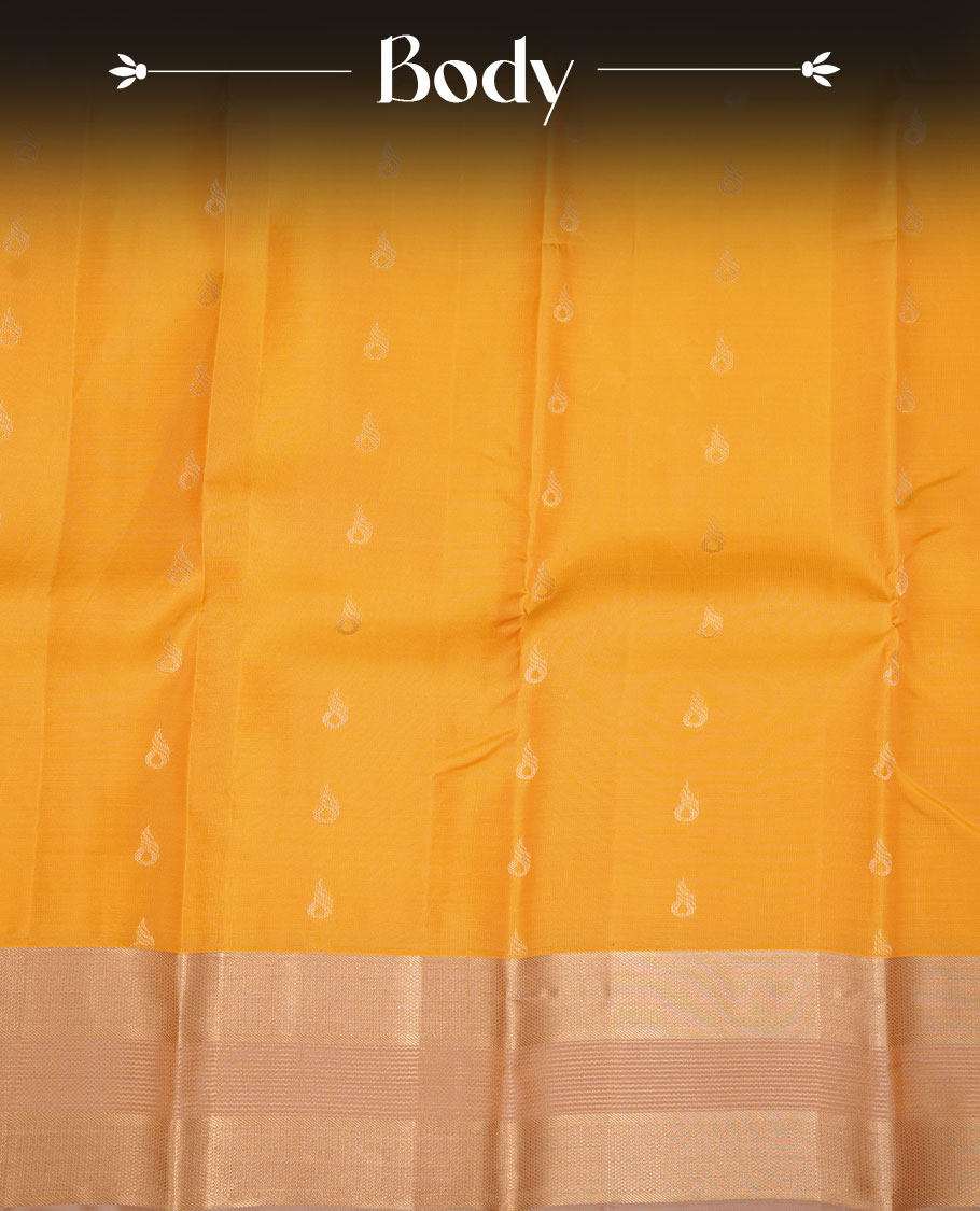 Mango yellow coloue vasundhara silk saree featuring zari buttas on body, complemented by contrast chikku with traditional border, paired with matching blouse piece
