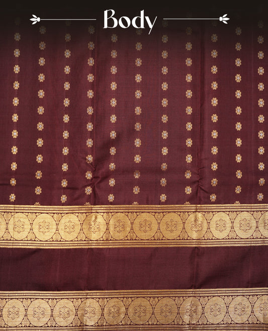 Chocolate colour Kancheepuram silk saree featuring Gold & silver Floral Pattern onbody, Highlighting Gold Zari border with Orange piping, paired with matching blouse piece.