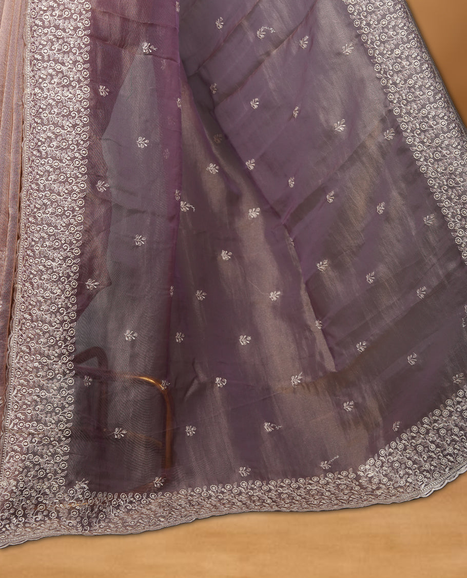 Pastel Purple colour net organza saree featuring white thread embroidery motifs on body and  thread detailing on the border and paired matching blouse.