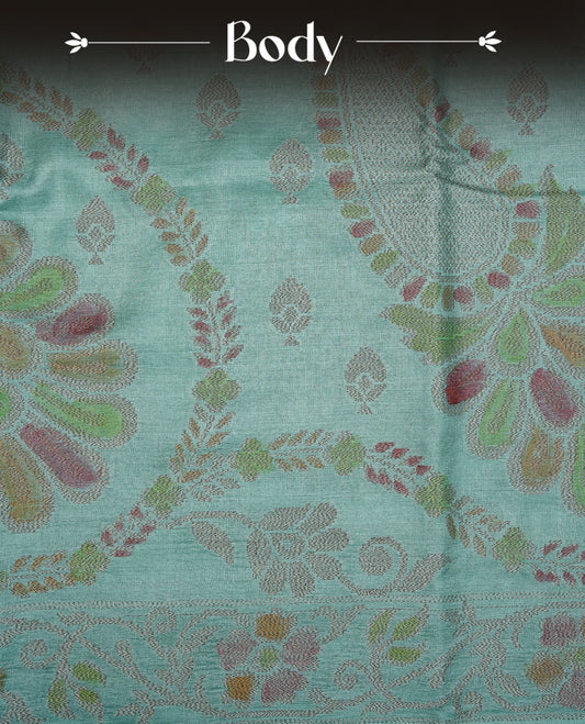 Pastel green colour pure tussar silk saree featuring elegant antique zari kodi patterns across the body, designed with a graceful borderless finish for a refined look. Paired with a matching blouse piece.