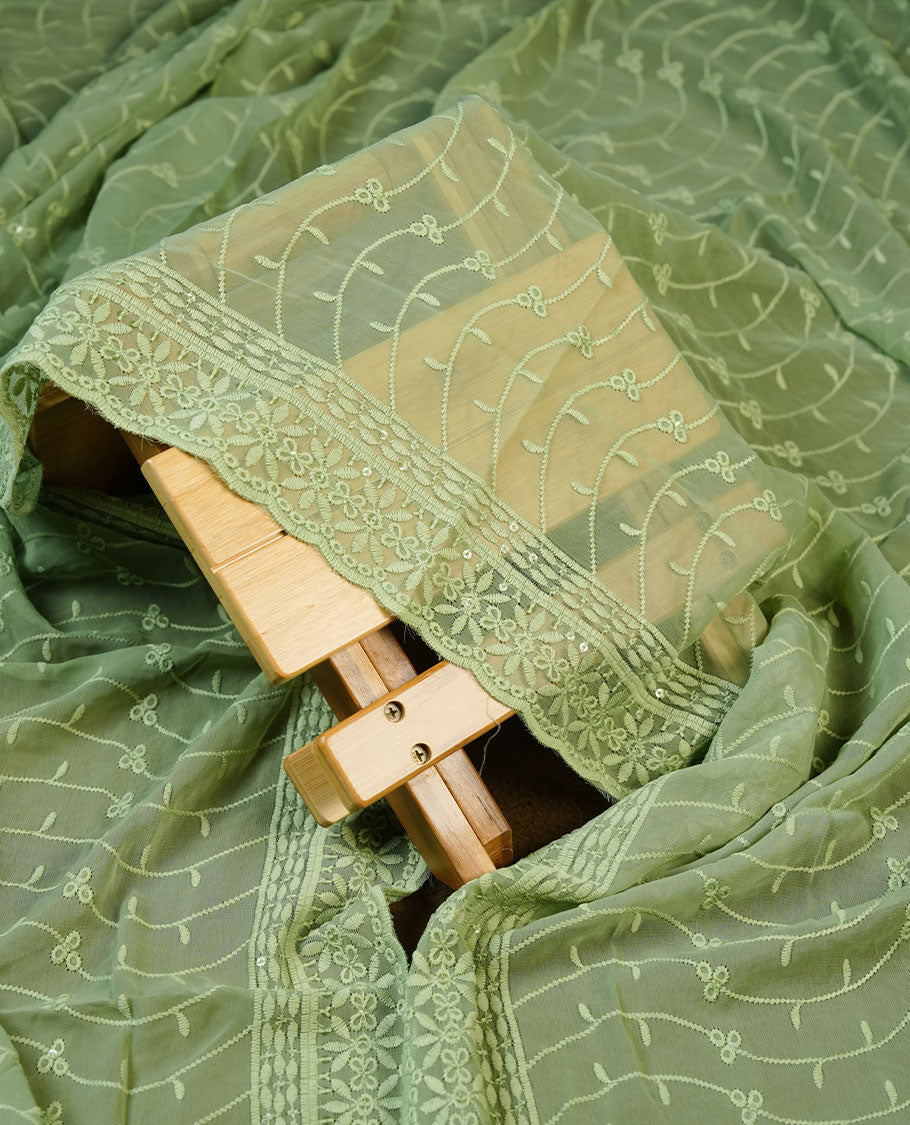 Pastel green colour churidhar Material featuring Intricate Thread Embroidery with Mirror and Cut Beads Work on the Front Panel, paired with an All Over Embroidered Net Dupatta and Matching Bottom