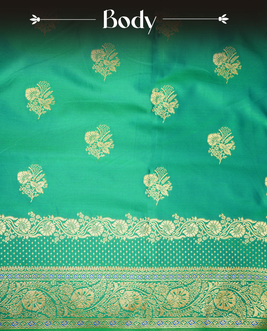 Green colour Banaras Satin Crepe saree featuring gold zari floral motifs on the body, a richly woven traditional border with intricate gold zari detailing, and paired with a matching blouse.