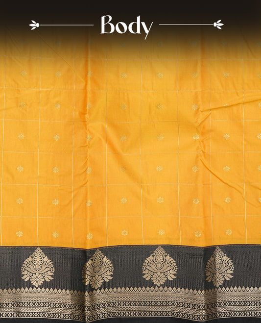 Yellow colour semi wedding silk saree featuring gold zari checks with buttas on body,contrast black colour with traditional border on body,rich pallu comes with matching blouse piece