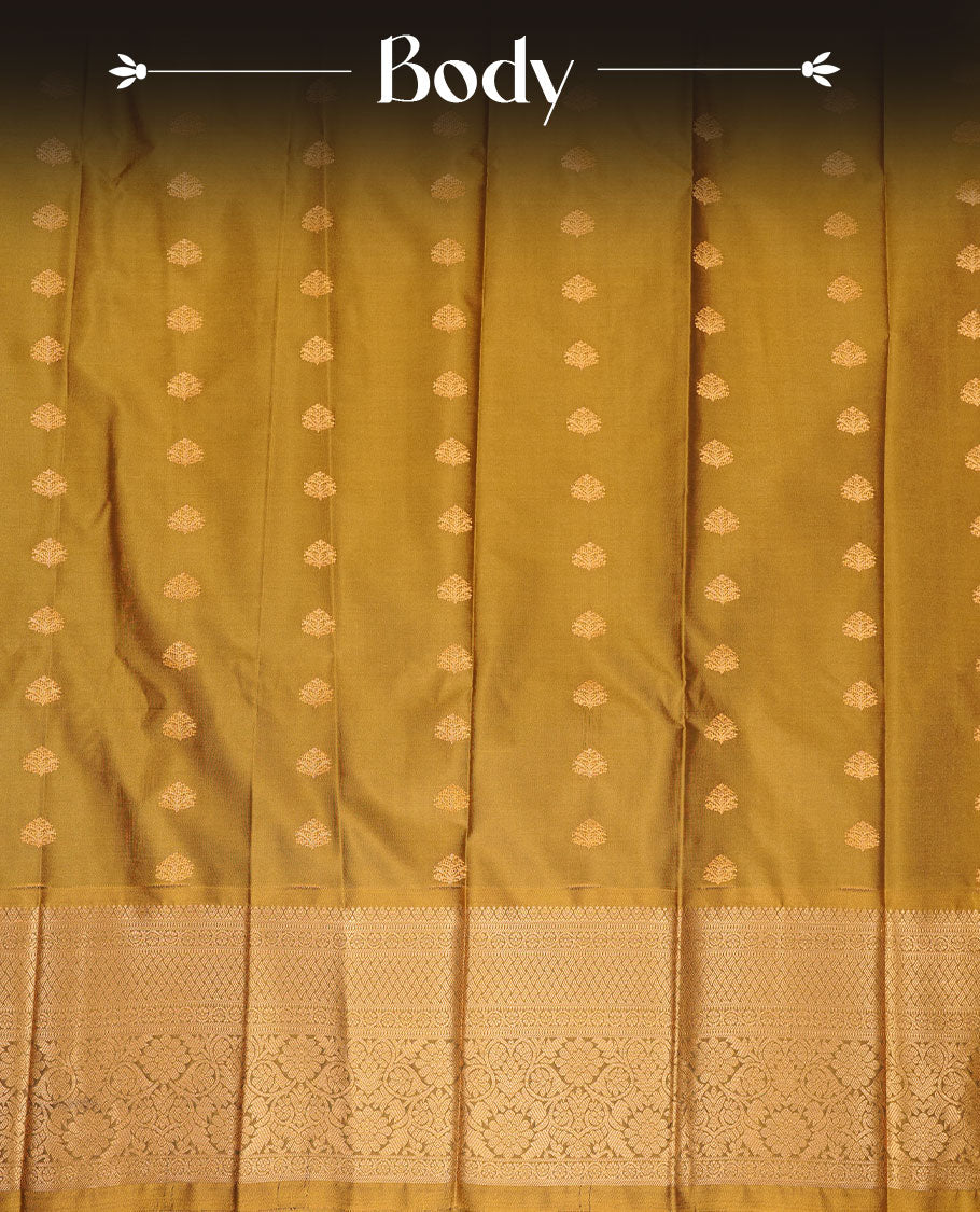 Olive colour soft silk saree featuring gold zari motifs on body, complemented by self colour with zari border, paired with matching blouse piece.