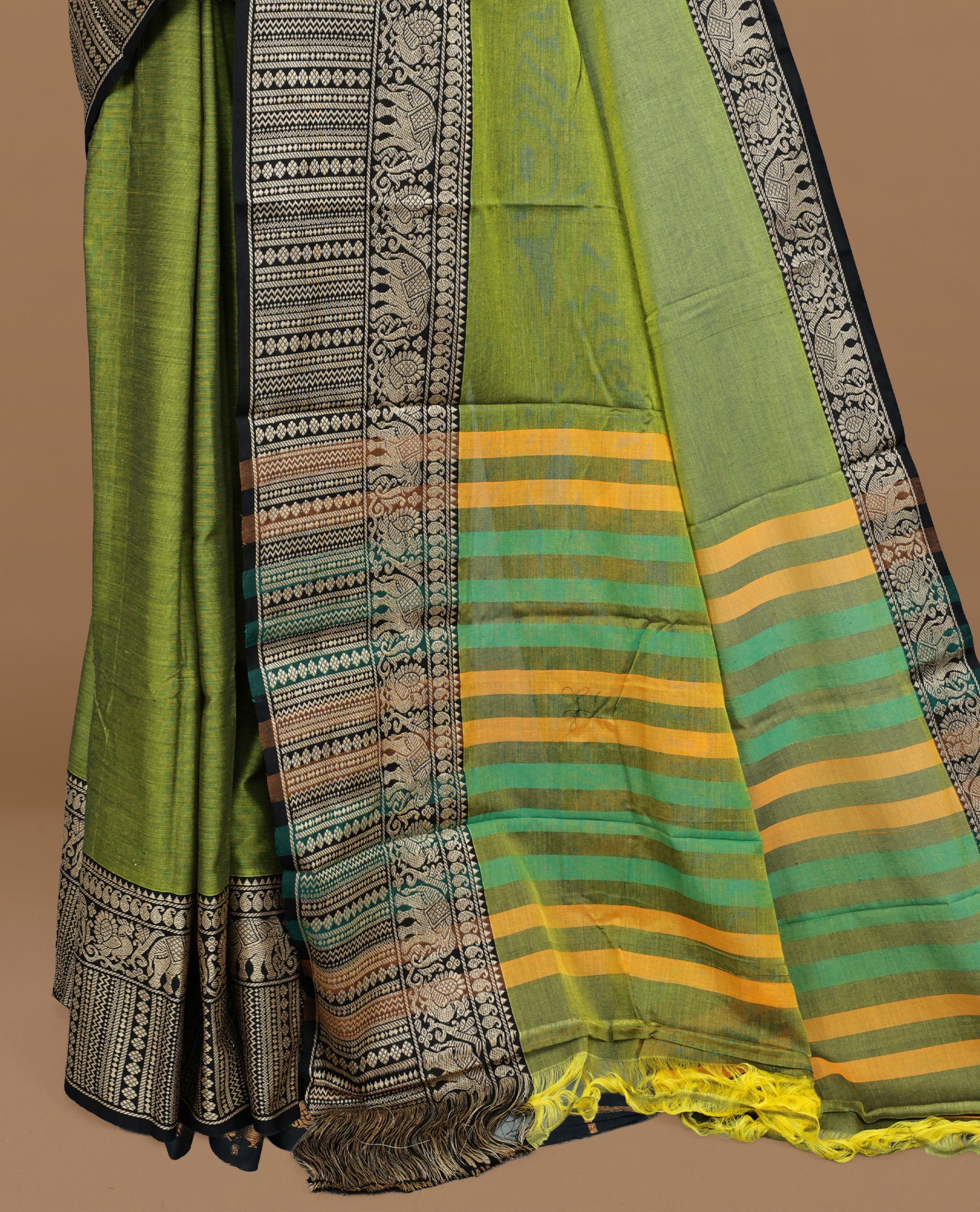 Green colour Narayanapett cotton saree Featuring Elegant plain Body, complemented by Contrast Black colour with cream zari border, paired with matching blouse piece.