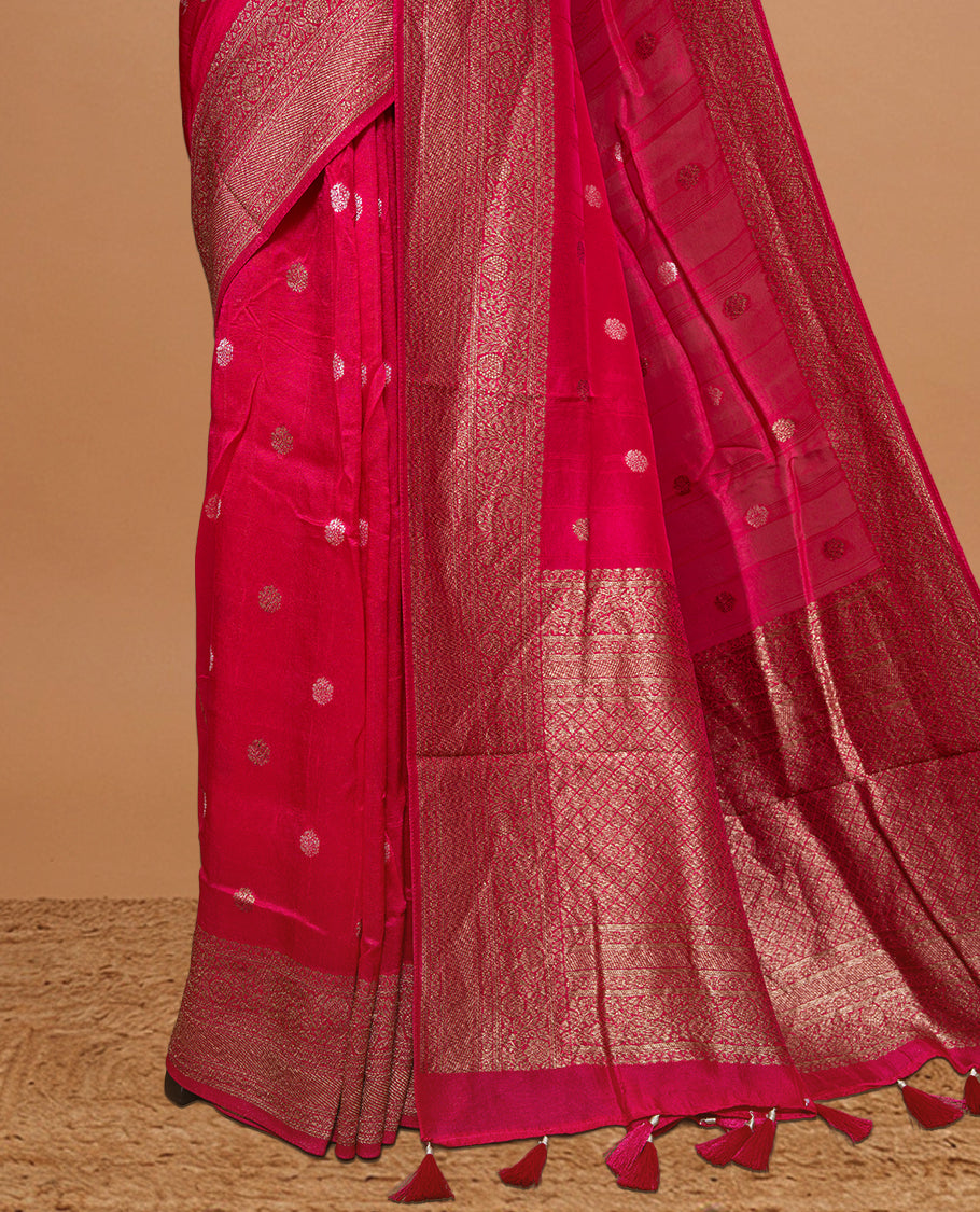 Magenta colour Semi banaras tussar georgette Saree featuring Antique zari motifs on body, enhanced with antique zari border, paired with a matching blouse piece.