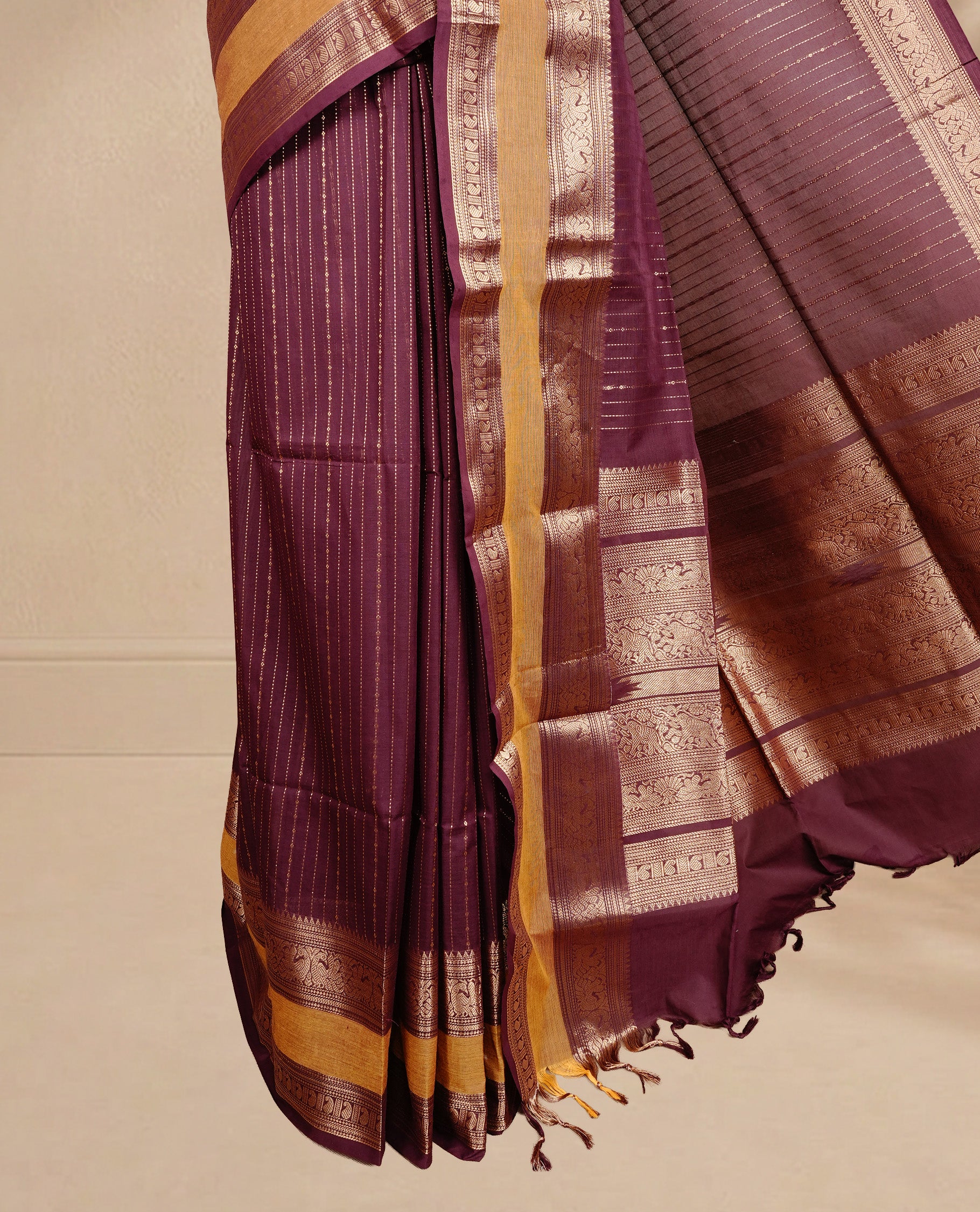 Maroon colour chettinad cotton saree featuring  gold zari stripes on body, complemented by Mustard border, paired with matching blouse piece.