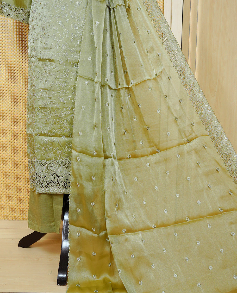 Olive green Colour churidar set with floral thread embroidery On body & U shaped Neckline, paired with a matching lace-bordered dupatta and solid pants.