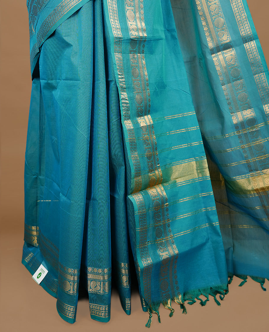 Aqua colour chettinad cotton saree featuring elegant plain body, complemented by self colour with zari border, paired with matching blouse piece.