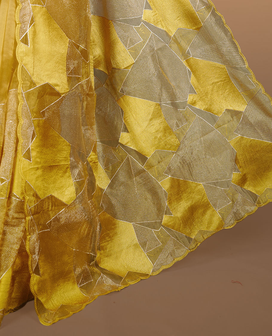 Yellow colour Organza designer saree featuring a thread geometric pattern across the body, enhanced with a piping border and cut beats work on matching blouse piece.