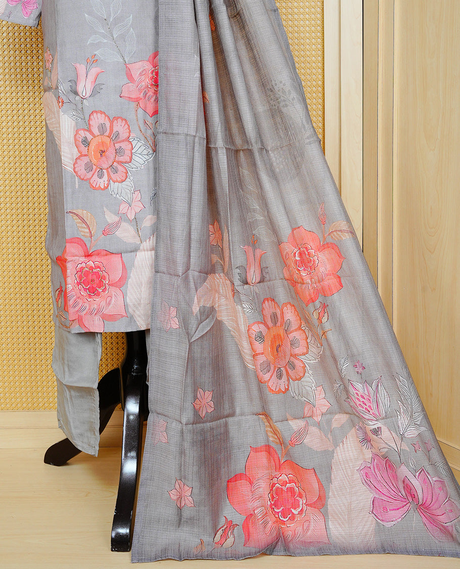 Grey colour churidar set featuring delicate floral prints on the body and intricate bead work on the neckline, paired with a matching floral printed dupatta and solid pants.